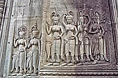 Angkor Wat temple, second enclosure, devatas sculpted in bas-relief with an extraordinary variety of intricate hair styles and costumes. 